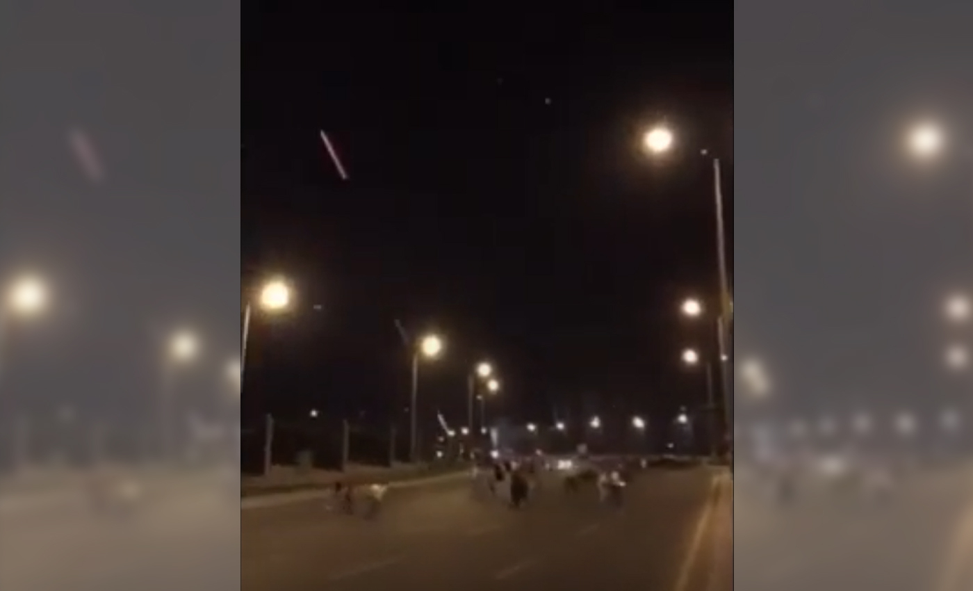A video shows a Russian military helicopter firing at civilians in Kyiv at night.