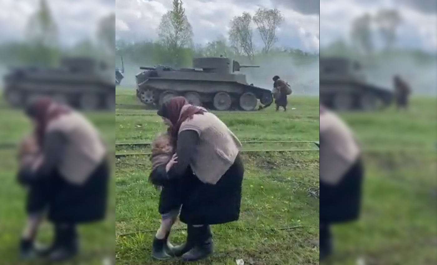 A video shows families fleeing the Russian invasion of Ukraine as a battle tank fires at people.