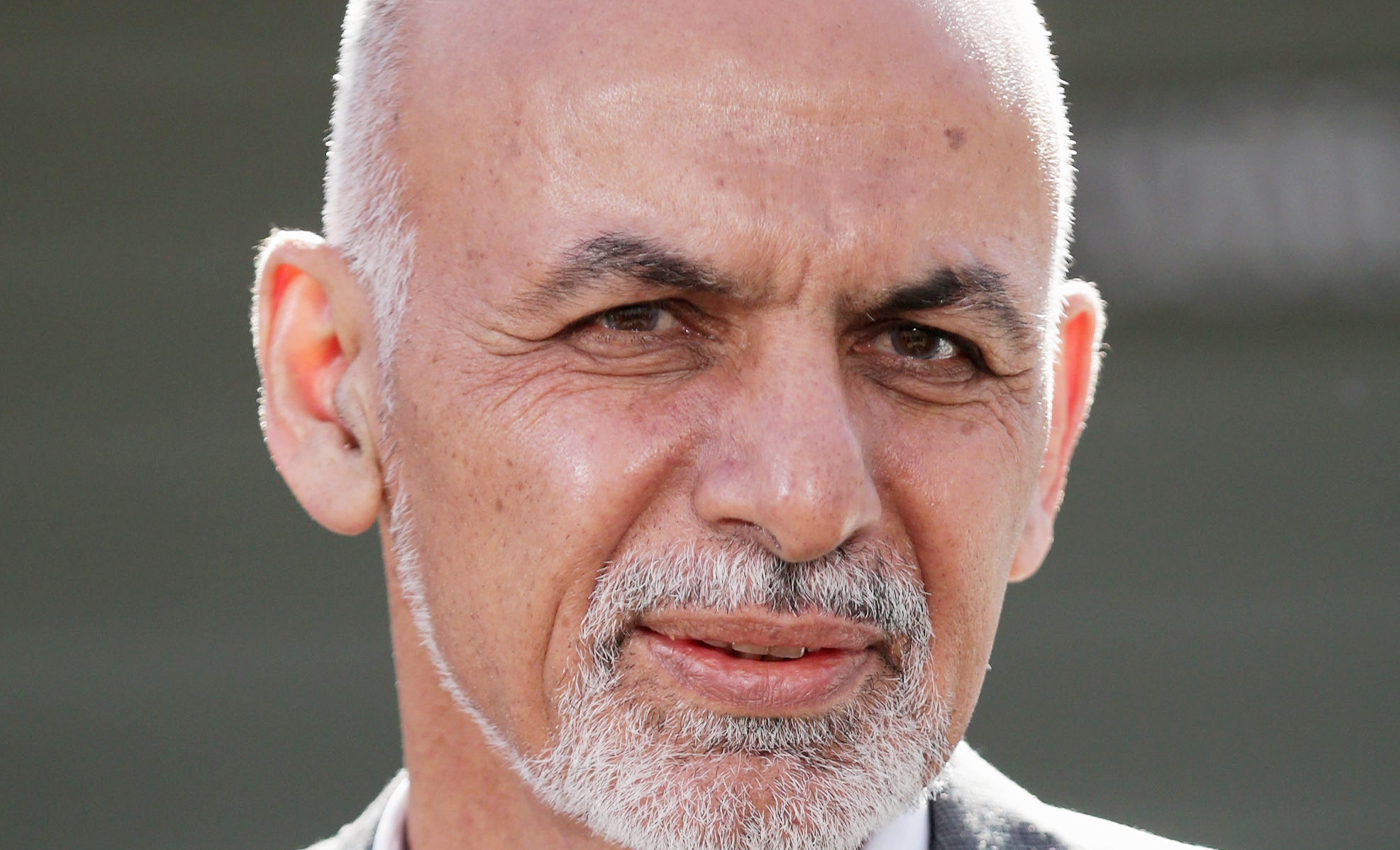 Afghanistan President hugged Taliban leaders in the presidential palace.