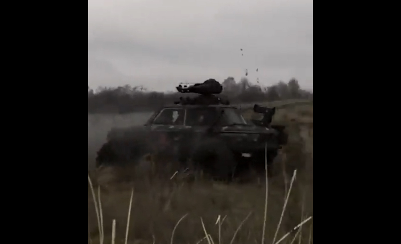 A video shows a scene from the Russian invasion of Ukraine, where an armored motorcar destroys tank convoys.