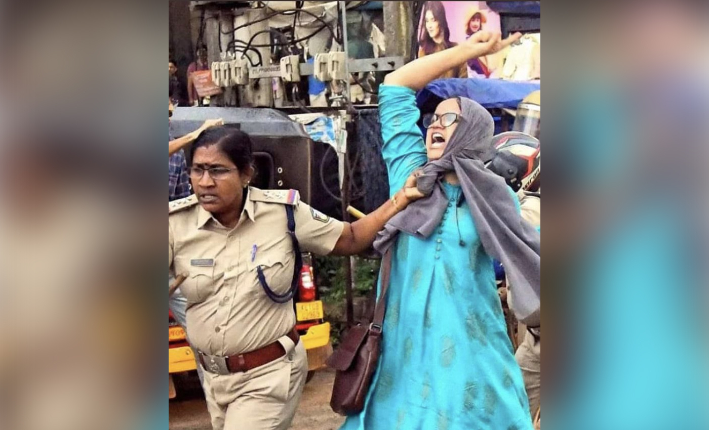 A viral image shows Rana Ayyub, a journalist, being arrested in Kerala.