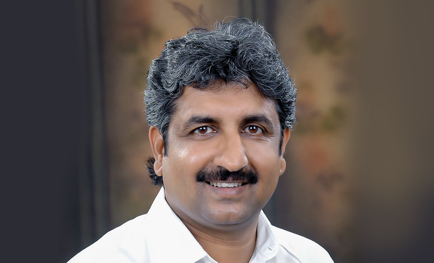Haveri-Gadag MP Shiva Kumar Udasi pushes a farmer who had to come to him with his grievances.