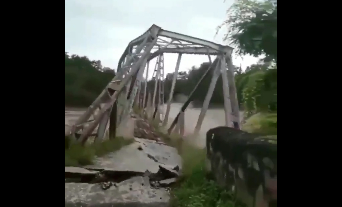 A video shows a bridge collapsing in Assam due to floods in May 2022.