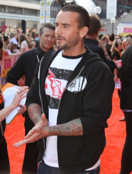 CM Punk made a crack about how WWE was begging him to come back for WrestleMania.