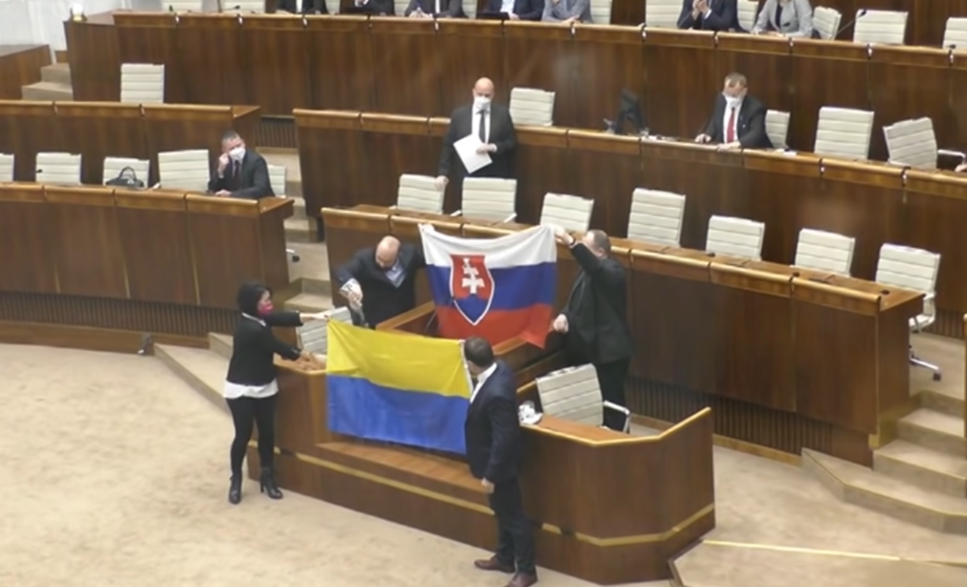 A video shows two Slovak lawmakers pouring water on the Ukrainian flag in an act of support for Russia amid its invasion of Ukraine.
