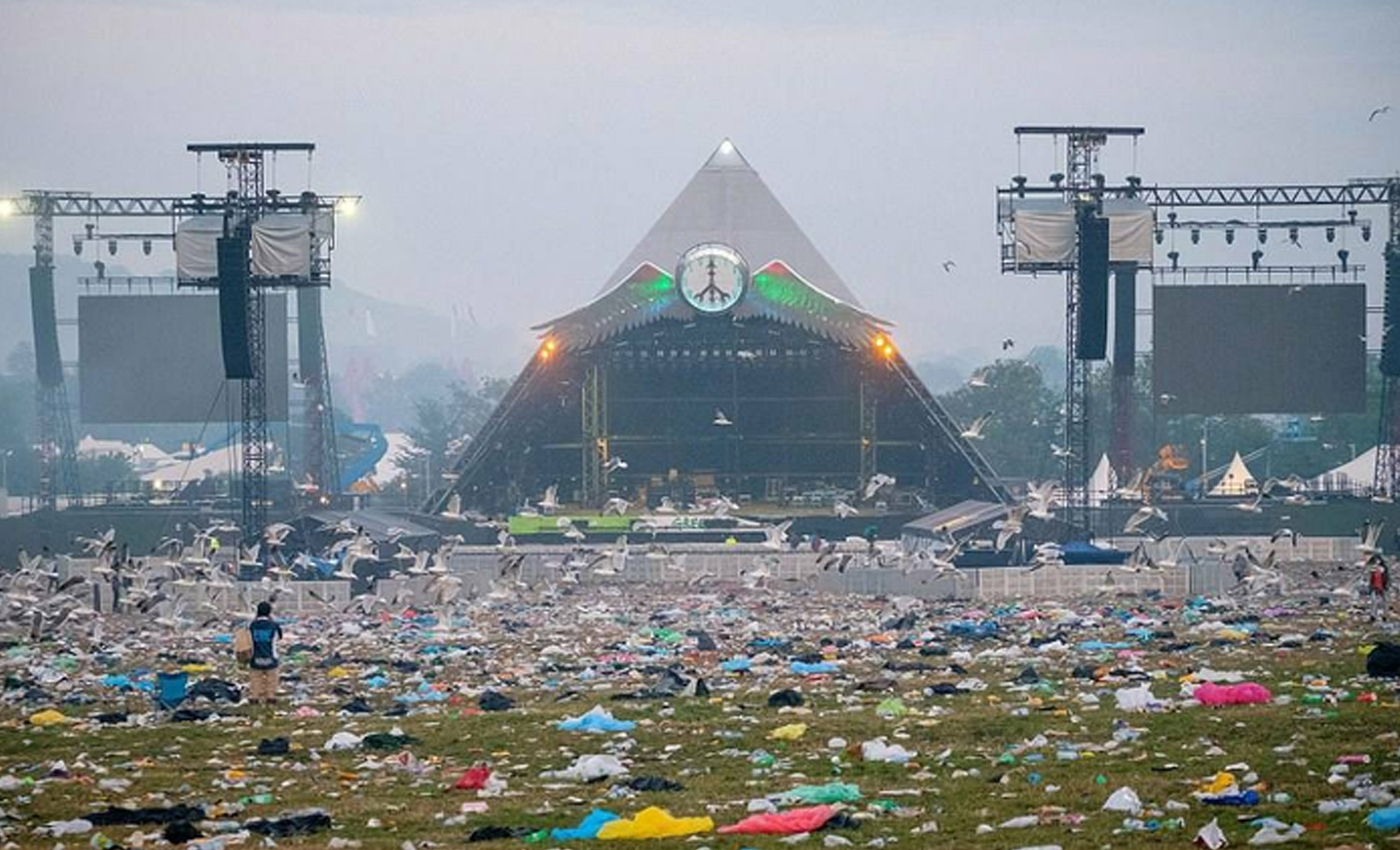 The image shows litter from the aftermath of the 2022 Glastonbury festival, where Greta Thunberg gave a speech on climate change.