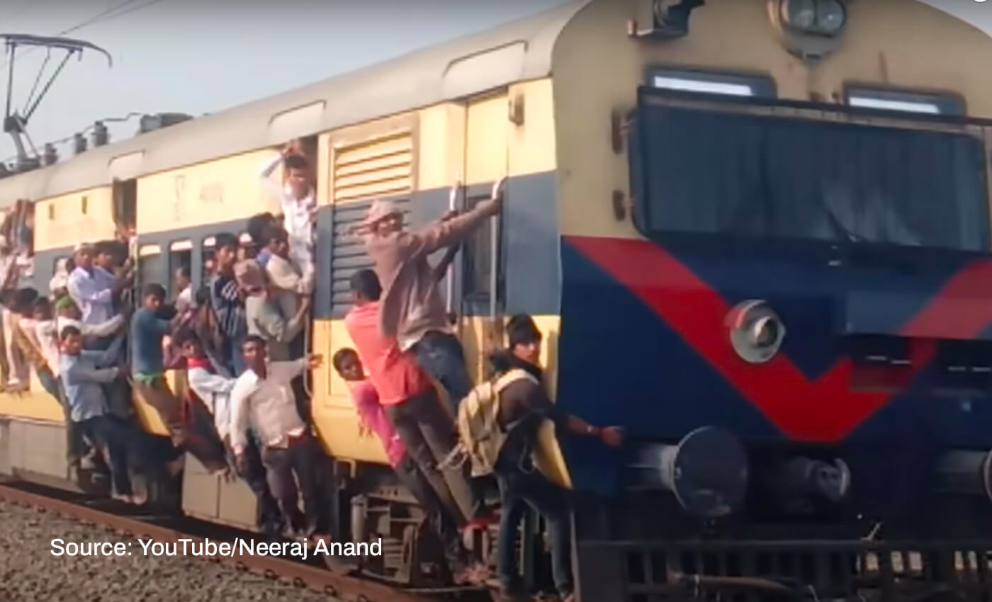2022 PET aspirants were sitting on a train's roof and hanging from the door amid overcrowding to reach exam centers in Uttar Pradesh.